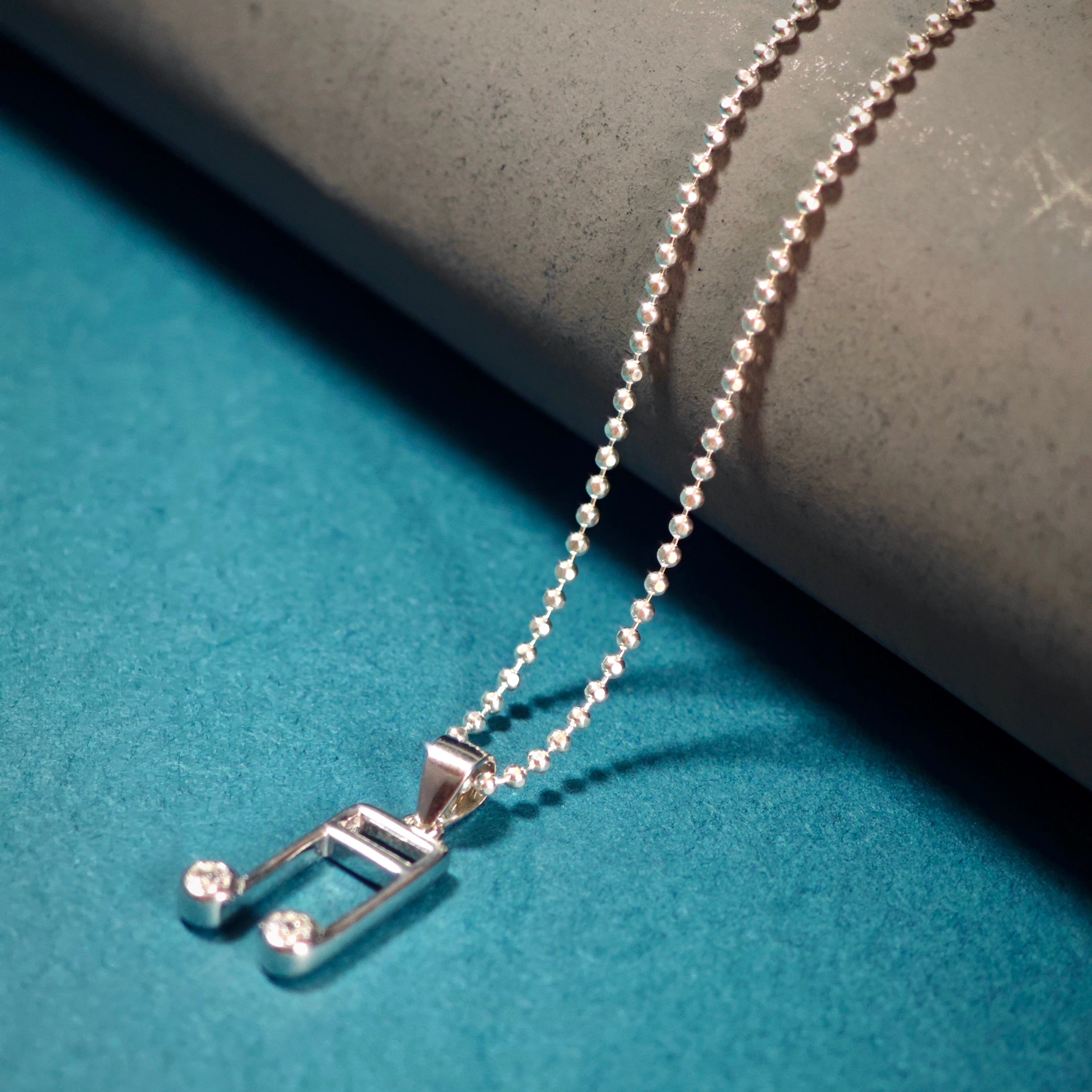 Necklace pendant music